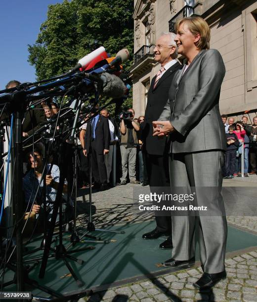 German chancellor candidate of the Christian Democratic Union Angela Merkel and Edmund Stoiber, governor of Bavaria and leader of the CSU, talk to...