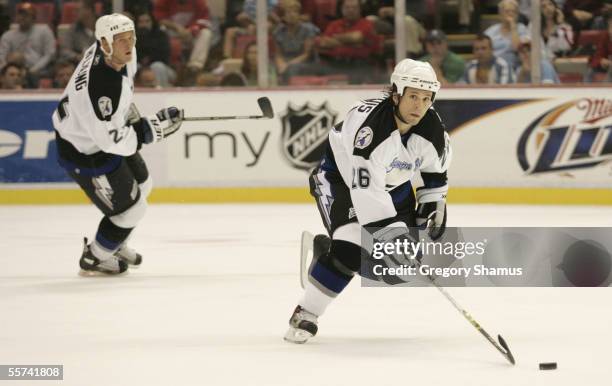 Martin St. Louis of the Tampa Bay Lightning skates with the puck during the preseason NHL game against the Detroit Red Wings at Joe Louis Arena on...