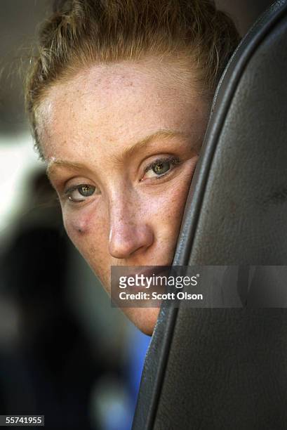 Brittany Feazell sits on a school bus as she waits to be evacuated ahead of Hurricane Rita September 22, 2005 in Galveston, Texas. Hurricane Rita is...