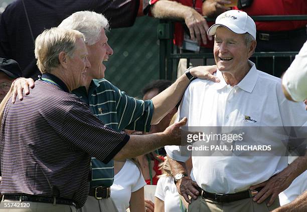 United States: Former Presidents of the US, Bill Clinton, and George H.W. Bush, co-chairmen of the 2005 Presidents Cup, joke with with USA team...