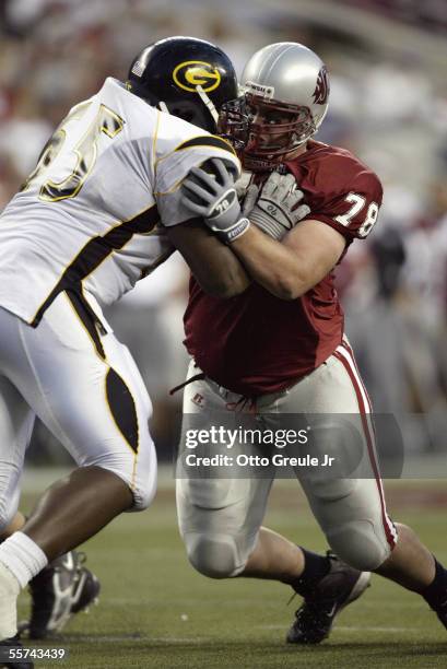 Defensive lineman Melvin Matthews of the Grambling State University Tigers battles with offensive lineman Riley Fitt-Chappell of the Washington State...