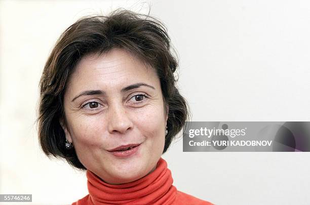 Moscow, RUSSIAN FEDERATION: Chechen lawyer Lida Yusupova speaks with AFP journalist in her home in Moscow, 23 September 2005. Lida Yusupova was 22...