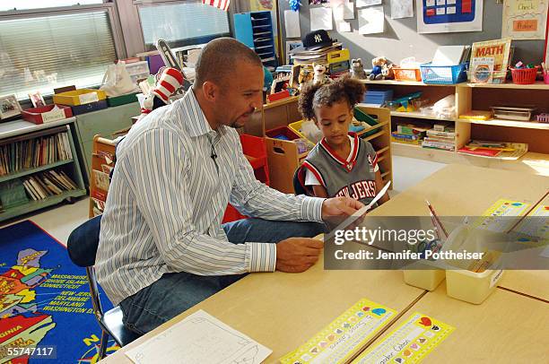 Jason Kidd attends class with first grader Angelique Allen at Tamaques Elementary School on September 23, 2005 in Westfield, New Jersey. Allen won...