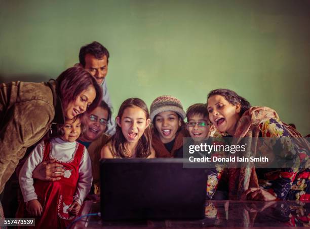 multi-generation family videochatting on laptop - indian aunt imagens e fotografias de stock