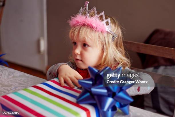 girl wearing tiara and holding gift - happy birthday crown foto e immagini stock