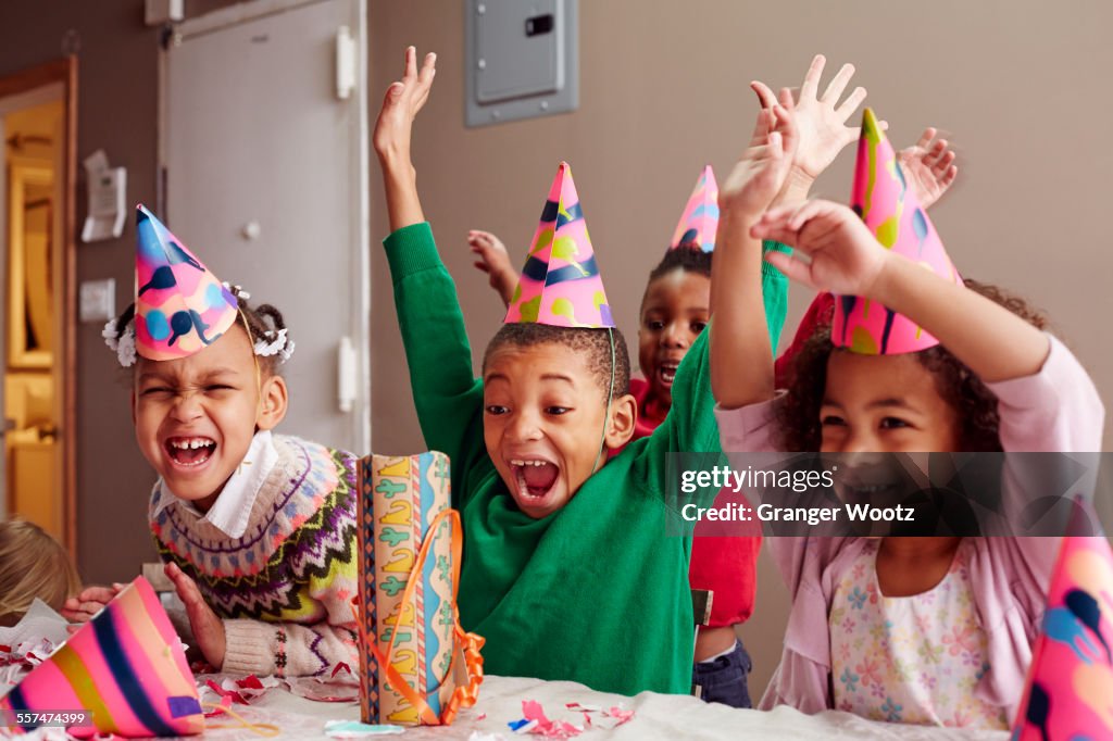 Children cheering at party
