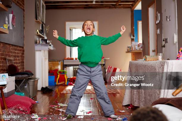 black boy shouting in living room - child shouting stock pictures, royalty-free photos & images