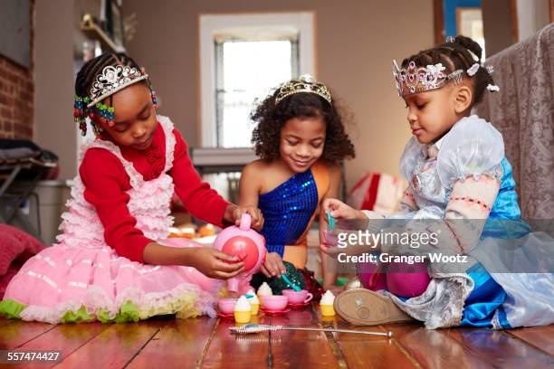 girls playing dress-up at tea party - princess stock pictures, royalty-free photos & images