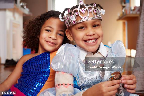 smiling girls playing dress-up - kids tiara stock pictures, royalty-free photos & images