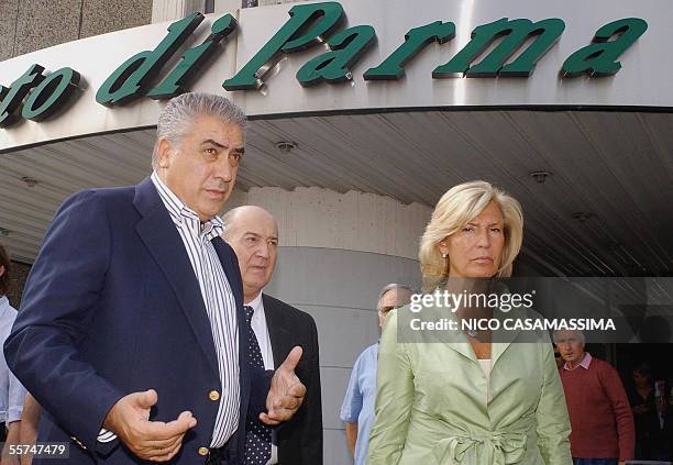 Former Real Madrid president Lorenzo Sanz arrives at the Parma's airport, next an unidentified woman,23 September 2005. Sanz has moved a step closer...