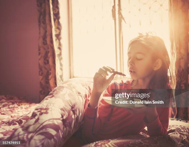 girl eating breakfast in bed - punjabi girls images 個照片及圖片檔