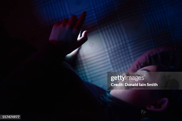 mixed race girl using cell phone at night - punjabi girls images 個照片及圖片檔