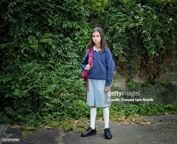 mixed race schoolgirl in uniform with backpack - palmerston north nz bildbanksfoton och bilder