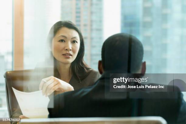 business people talking behind window in office meeting - serious interview stock pictures, royalty-free photos & images