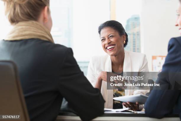 business people laughing in office meeting - asian young executive laughing office bildbanksfoton och bilder