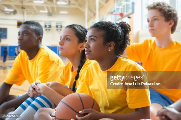 basketball team listening to coach during practice in gym - pro 14 stock pictures, royalty-free photos & images