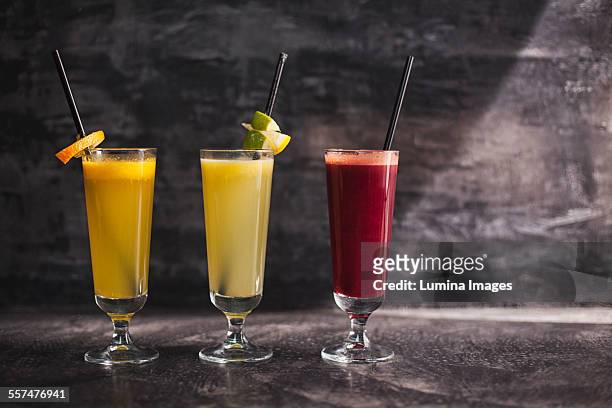 close up of variety of healthy juices - smoothie close up textfreiraum stock-fotos und bilder