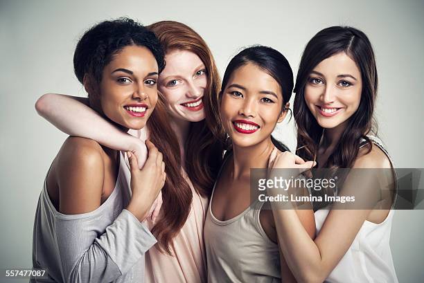 close up of smiling women hugging - portrait close up woman 20 29 stock pictures, royalty-free photos & images