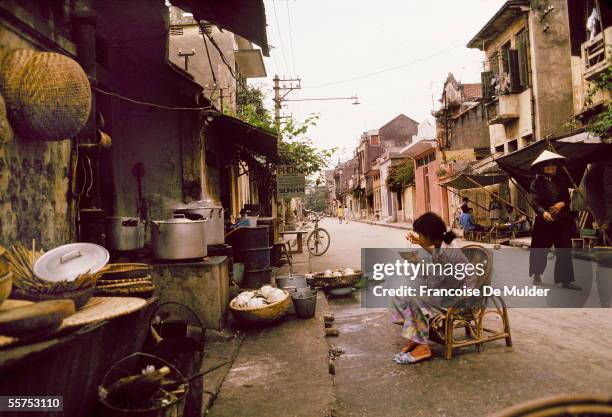 Tasting soup Pho in the street. Hanoi , on 1989. FDM-3-7.