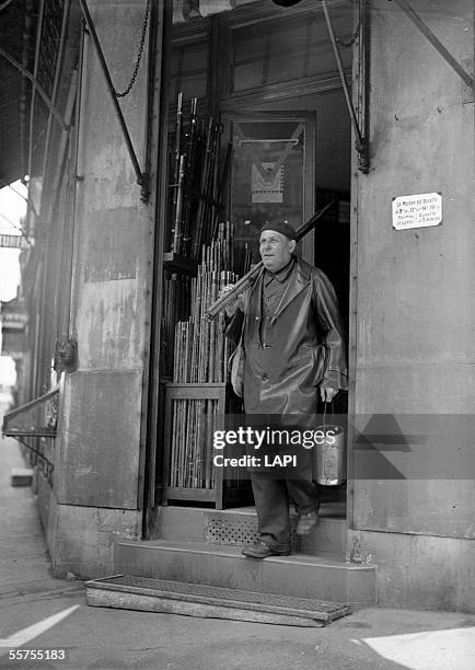 War 1939-1945. Fisherman leaving a specialized store during the opening of the peach. Paris, June 13, 1941. Roger Viollet via Getty Images-3252.