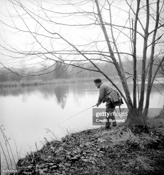 Fish in river in the light trow. France, on 1950's. Burnand-2036.