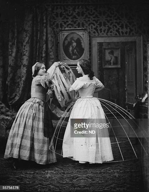 Woman putting a crinoline under the Second Empire.