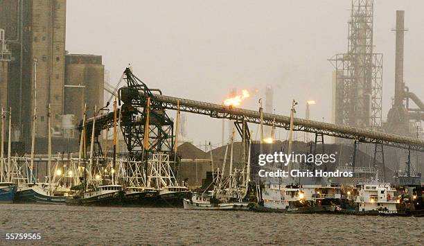 Boats line up near an oil refinery at the Port of Beaumont as Hurricane Rita approaches September 23, 2005 in Beaumont, Texas. Hurricane Rita, which...