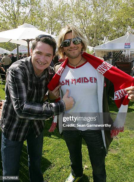 Comedian Dave Hughes poses with TV personality Andrew G prior to the 2005 AFL Grand Final between the Sydney Swans and the West Coast Eagles at the...