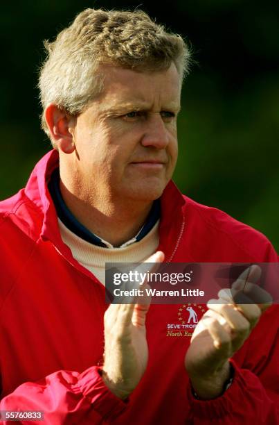 Captain of the Great Britain & Ireland team claps on his team mates on the eighth during the Greensomes matches of the Seve Trophy at The Wynyard...