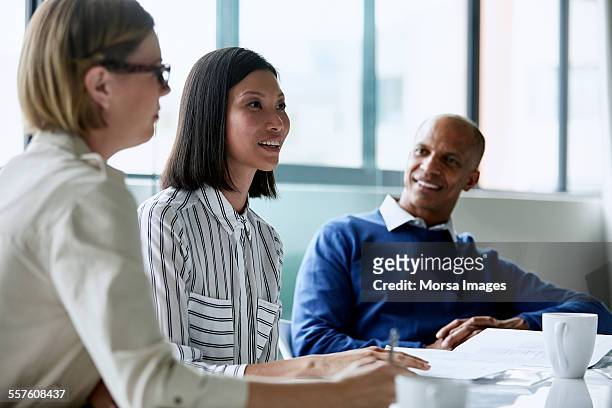 businesswoman having discussion with colleagues - small group of people stock pictures, royalty-free photos & images