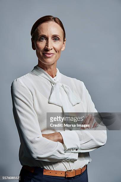 portrait of confident businesswoman - white blouse imagens e fotografias de stock