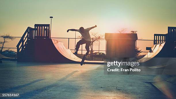 skateboarder jumping. - skating park stock pictures, royalty-free photos & images