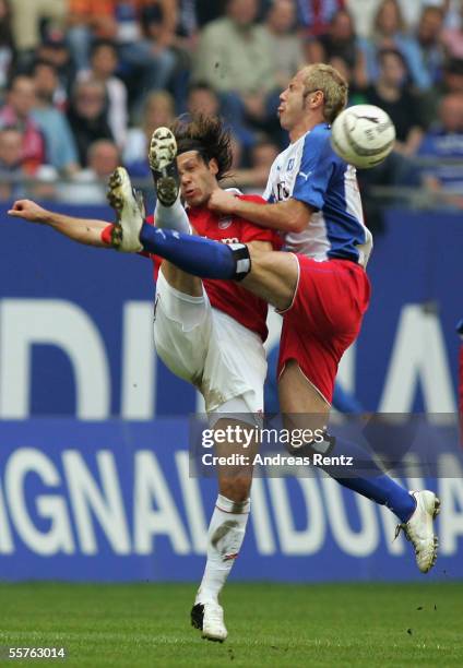 Sergej Barbarez of Hamburg challenges for the ball with Martin Demichelis of Munich during the Bundesliga match between Hamburger SV and Bayern...