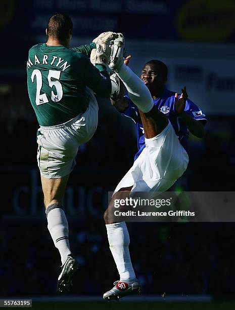 Nigel Martyn and Joseph Yobo of Everton go up for the same ball during the Barclays Premiership match between Everton and Wigan Athletic on September...