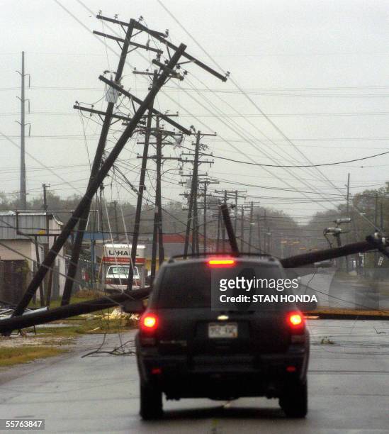 Down utility poles block a street, 24 September in Port Arthur, Texas, after Hurricane Rita passed over the Gulf coast. Rita gave the US Gulf Coast...