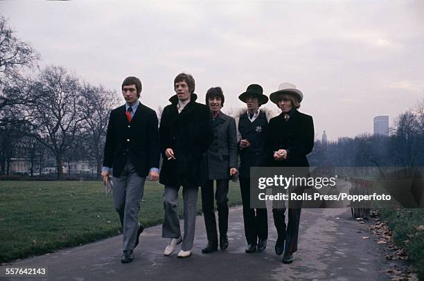 The Rolling Stones pictured walking together for a press call in Green Park, London on 11th January 1967. From left to right: Charlie Watts, Mick...