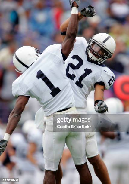 Cornerback Anwar Phillips of the Penn State Nittany Lions celebrates with Alan Zemaitis on his last minute interception against the Northwestern...