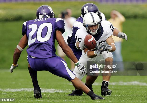 Wide receiver Brendan Perretta of the Penn State Nittany Lions loses the ball to cornerback Marquice Cole of the Northwestern Wildcats for a turnover...