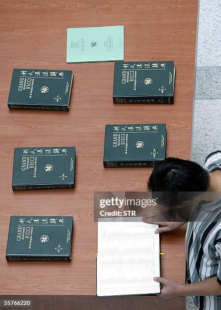 Chinese visitor browses the Grand Ricci dictionary, which features manuscripts of the Grand Ricci, a seven-volume encyclopaedic dictionary compiled...