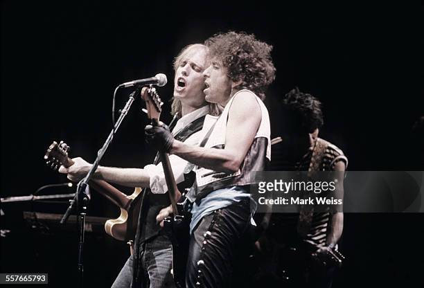 Tom Petty, Bob Dylan and Ron Wood perform on stage, United States, 1986.