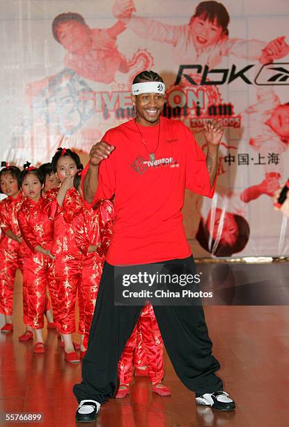 Player, Philadelphia 76ers guard Allen Iverson plays games with orphans at Shanghai Children's Welfare Center on September 24, 2005 in Shanghai,...