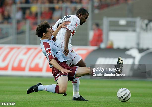 Cacao of Stuttgart and Torsten Reuter of Kaiserslautern battle for the ball during the Bundesliga match between VFB Stuttgart and 1.FC Kaiserslautern...