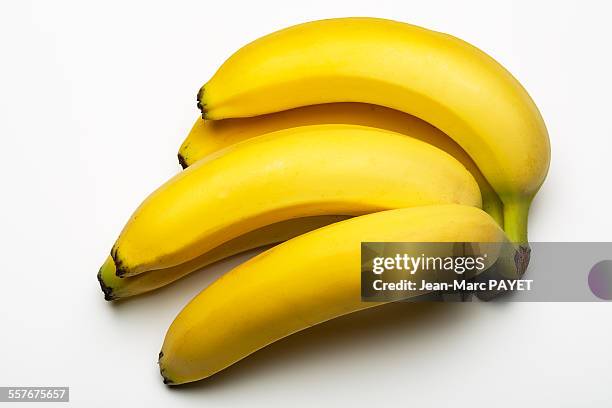 banana bunch isolated on white - jean marc payet - fotografias e filmes do acervo