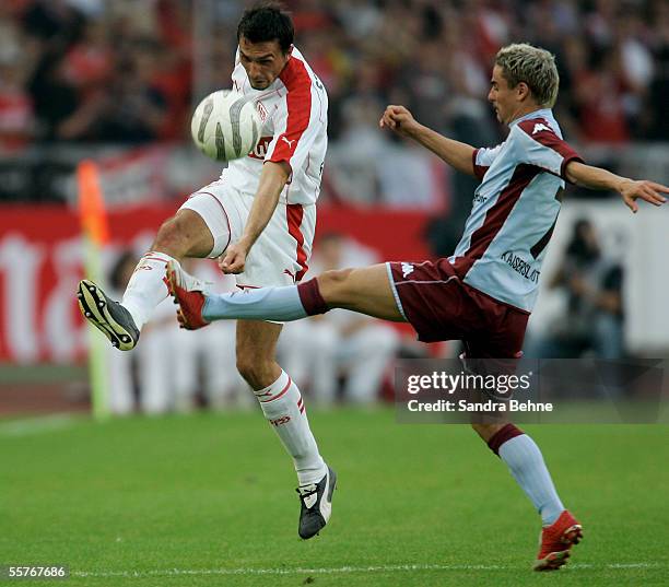 Martin Stranzl of Stuttgart challenges Ervin Skela of Kaiserslautern during the Bundesliga match between VFB Stuttgart and 1.FC Kaiserslautern at the...