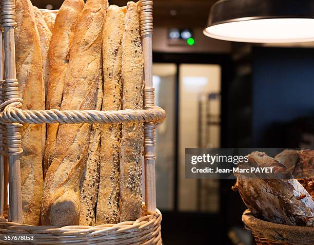 french baguettes in a bakery - jean marc payet photos et images de collection