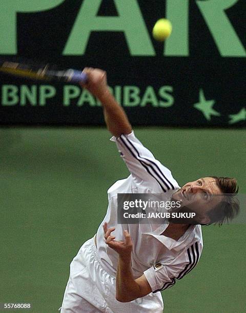 Slovakia's Karol Kucera returns a ball to Argentina's Marianno Puerta during the last match in World group semifinal Davis Cup match between Slovakia...