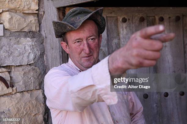 rural man pointing out. - mountain village stock pictures, royalty-free photos & images