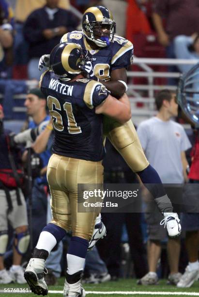 Marshall Faulk of theSt. Louis Rams celebrates his touchdown with Tom Nutten in the first half against the Tennessee Titans on September 25,2005 at...