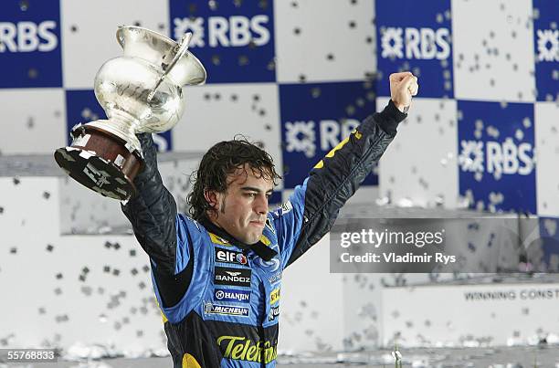 Fernando Alonso of Spain and Renault celebrates winning the World Championship after coming third in the Brazilian F1 Grand Prix at the Autodromo...