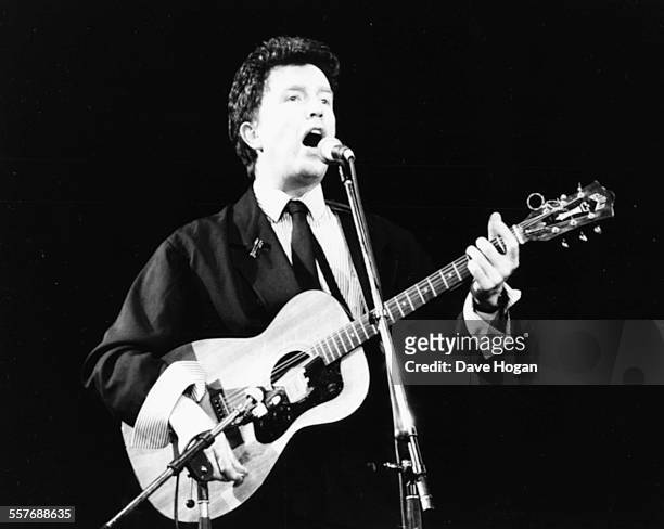 Musician Tom Robinson performing on stage at a charity concert to raise AIDS awareness, Wembley Arena, London, April 3rd 1987.